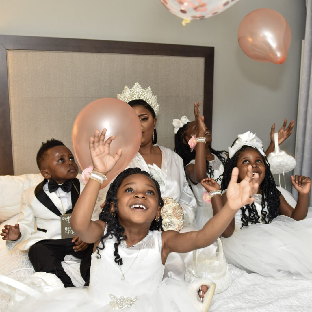 bride with flower girls and ring bearer