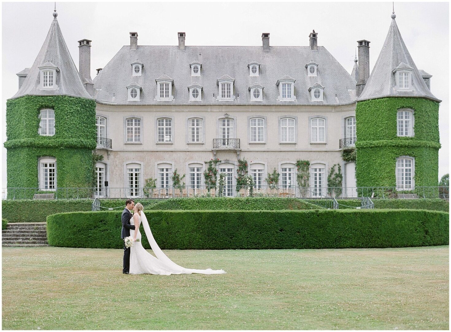 Elegant wedding at Château de la Hulpe in Wallonia, showcasing timeless European romance with classic French architecture and lush greenery.